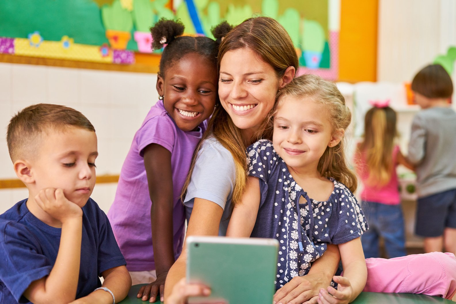 Childminder and Children Take a Selfie in the after-School Care